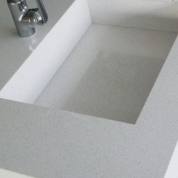 Beach Iceberg Grey Granite being used in a kitchen sink environment