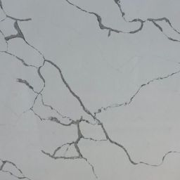 Calacatta Grigio with a clean white background, light grey detail and striking grey veining