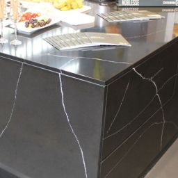 Noblesse Black Granite Slab shown on a kitchen countertop and sides