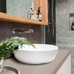 Noblesse Sand Granite Slab being used as a bathroom sink counter top