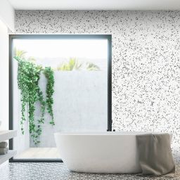 Terrazzo White granite used as a splashback featuring a unique combination of white, grey, and black speckles and veins,