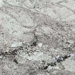Taupe White Granite has a marble-like appearance with a white background, soft grey lines, and hints of gold.